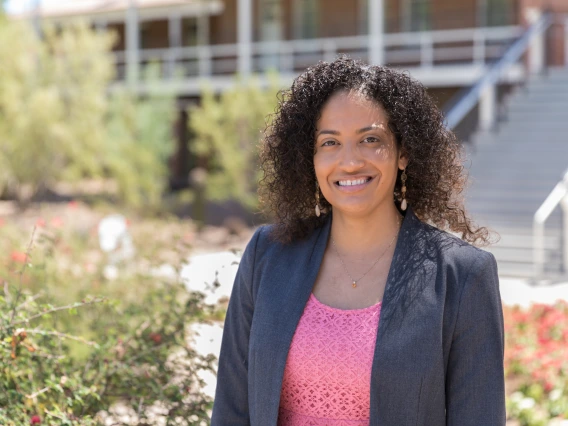 Desiree Vega in standing in front of Old Main