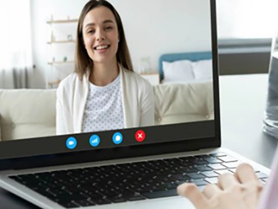 laptop user using a laptop for a webinar