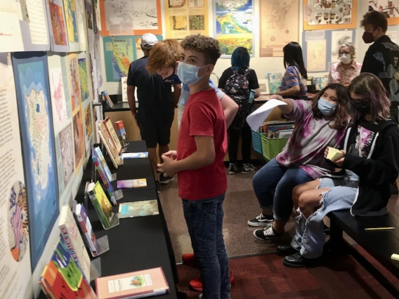 several patrons browsing a library exhibit