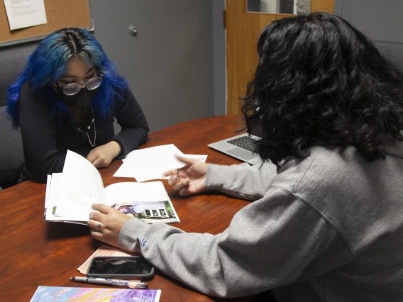 student sitting across from Felisia Tagaban Gaskin supporting Indigenous high schoolers in higher education