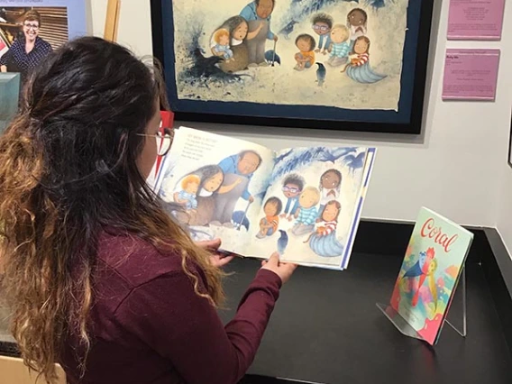 girl looking at book