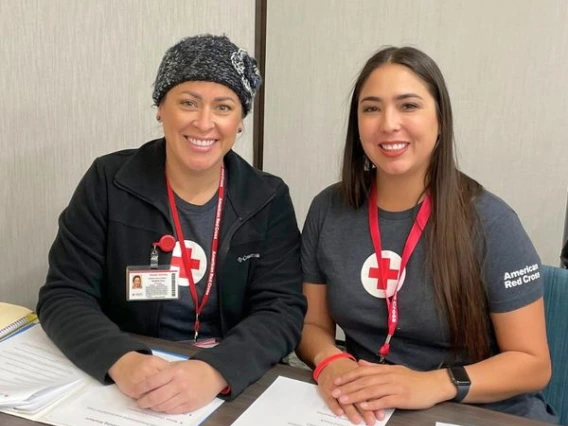 professor vannesa perry and graduate student stephanie moller sitting side by side at a table