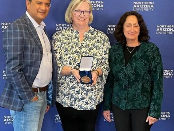 martha canipe holding award with two others