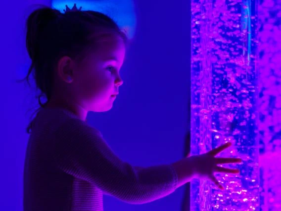 child in sensory stimulating room