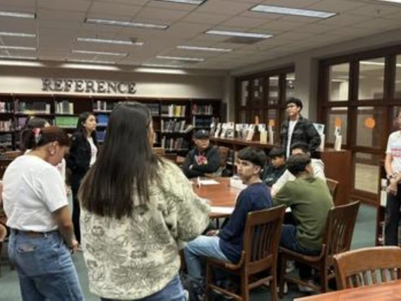 group of students and educators gathered in a library