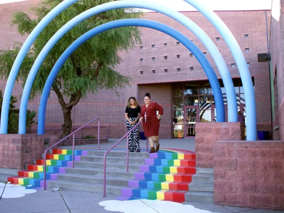 educators standing on school steps