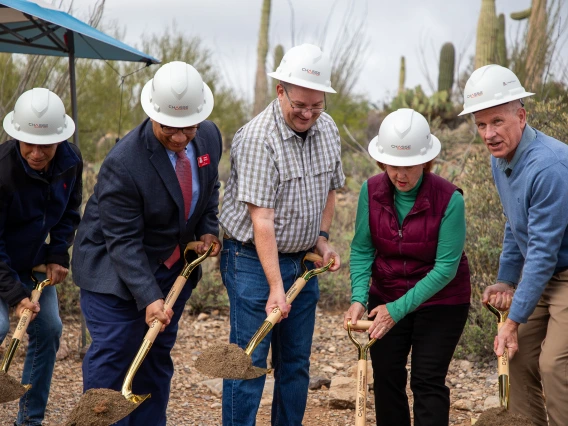 ground breaking ceremony, individuals holding shovels and breaking ground