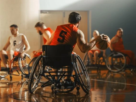 Wheelchair Basketball Game Court, Player in wheelchair Dribbling Ball, Prepairing to Shoot and Score a Goal