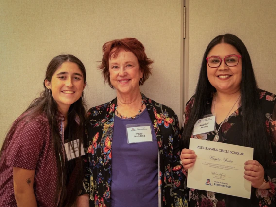 peggy goulding standing with two other women accepting her award