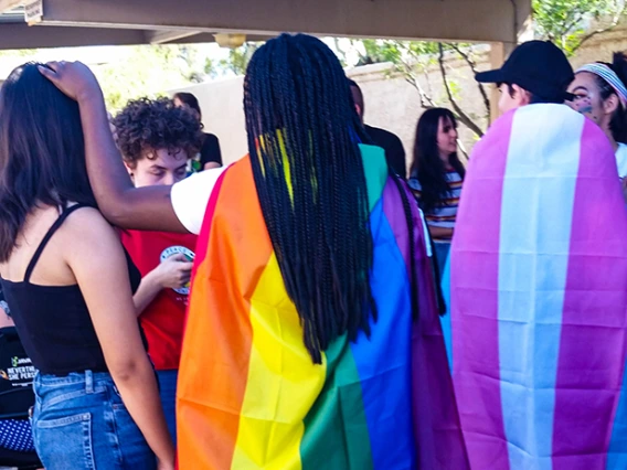 diverse group of young adults gathered in a group