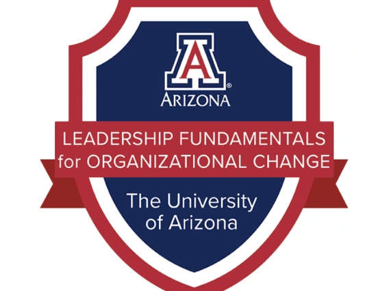 University of Arizona Leadership Fundamentals for Organizational Change badge featuring a red and blue shield with the university's 'A' logo at the top and text on a red ribbon banner.