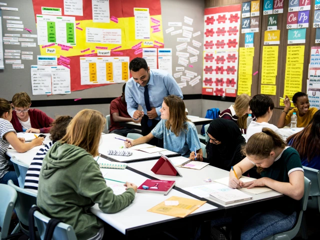 A male teacher motivates his classroom