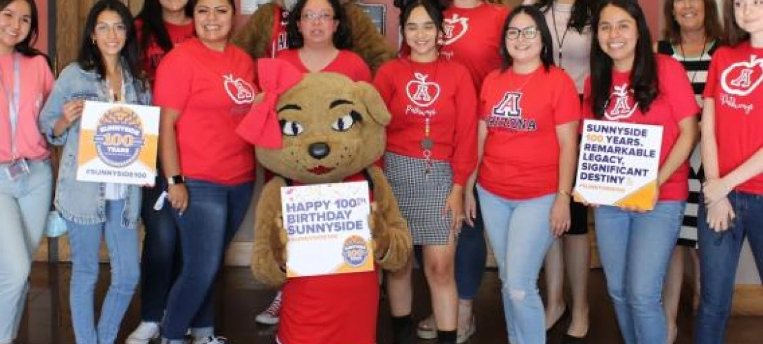 Celebrating Sunnyside 100 Birthday Pathways group photo with Wilbur and Wilma Wildcat