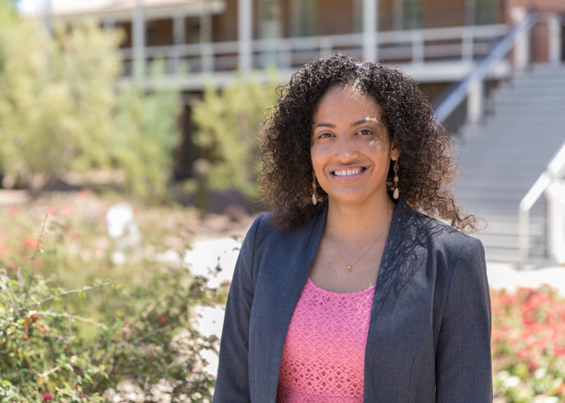 Desiree Vega in standing in front of Old Main