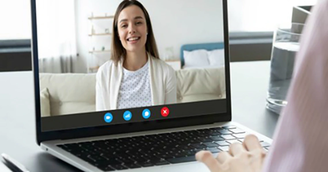 laptop user using a laptop for a webinar