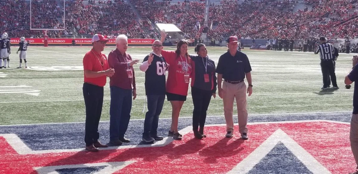 group picture on bear down football field