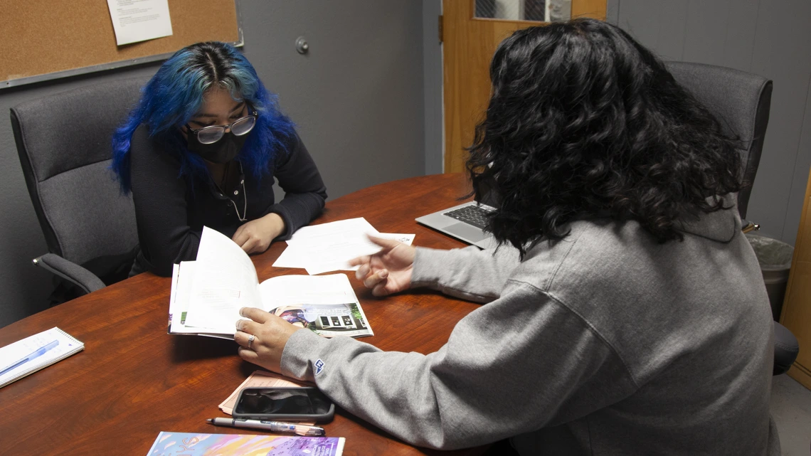 student sitting across from Felisia Tagaban Gaskin supporting Indigenous high schoolers in higher education