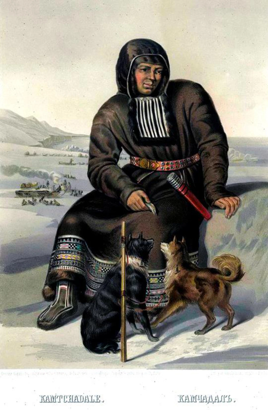 itelmen sitting on a rock with two dogs at his feet