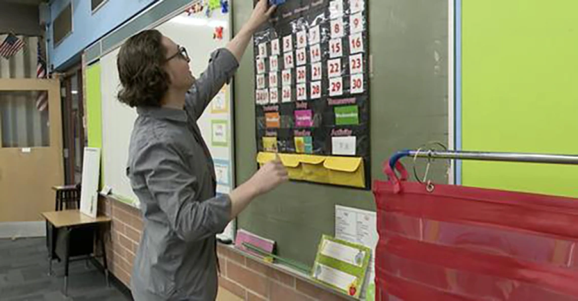 mark anthony ferguson in the classroom at the chalkboard