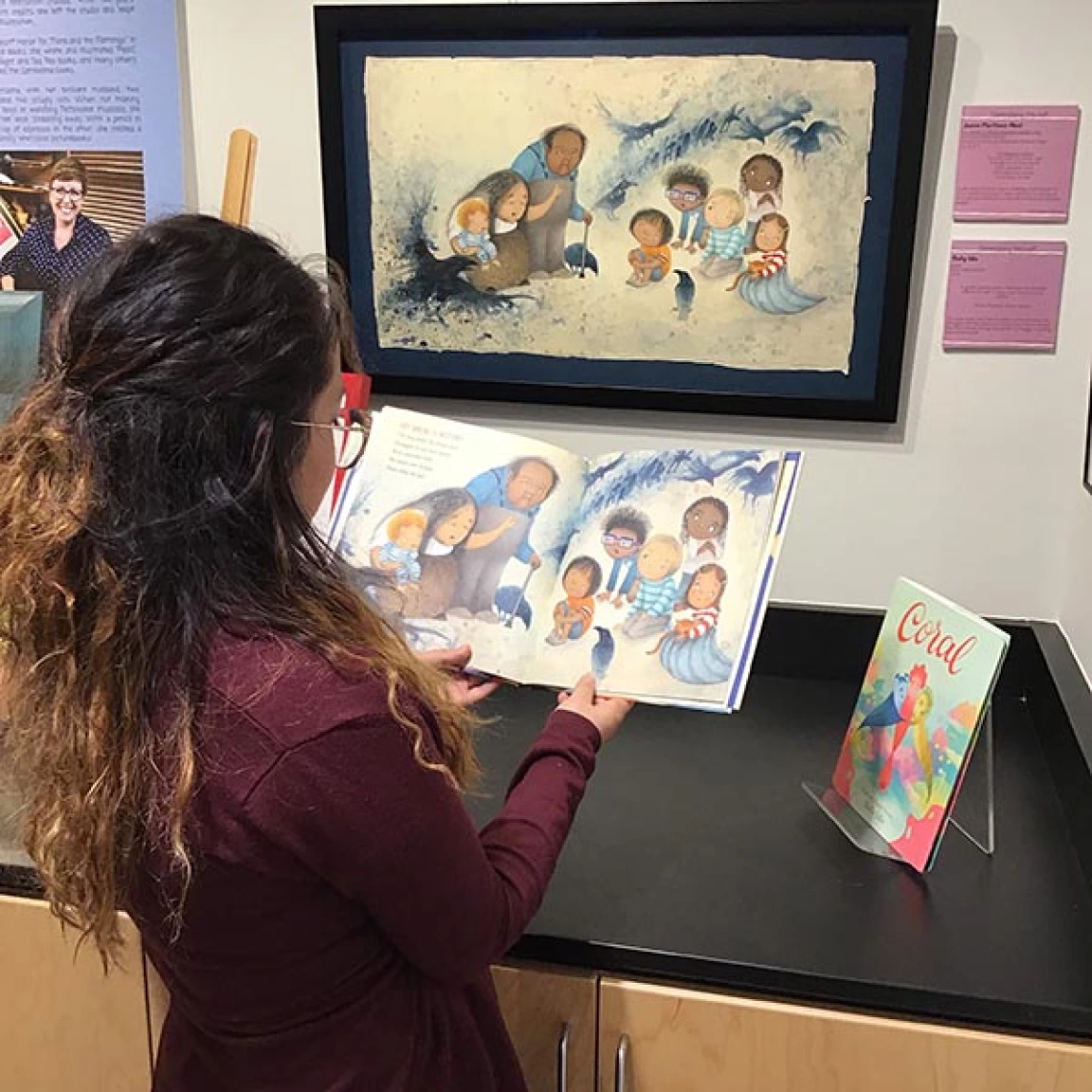 girl looking at book