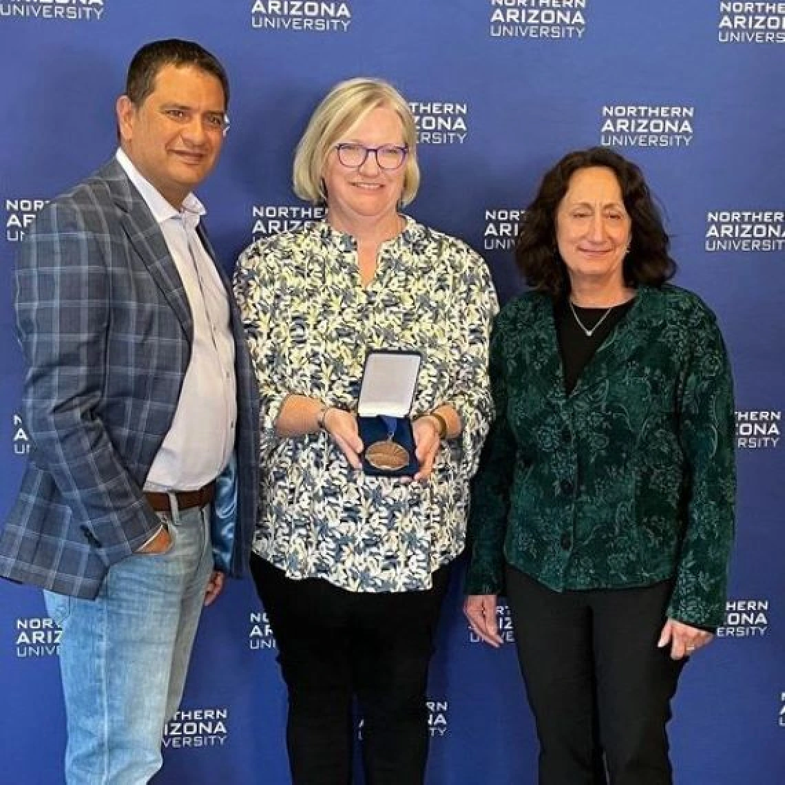 martha canipe holding award with two others