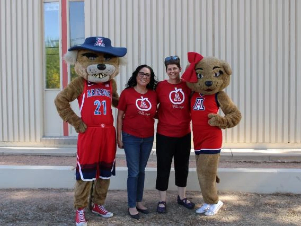 Maria Orozco and Marcy Wood with Wilbur and Wilma Wildcat