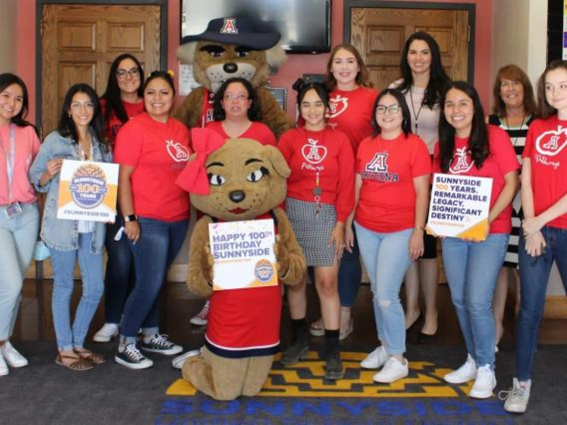 Celebrating Sunnyside 100 Birthday Pathways group photo with Wilbur and Wilma Wildcat