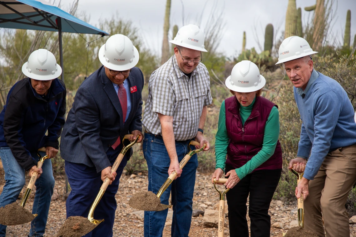 ground breaking ceremony, individuals holding shovels and breaking ground