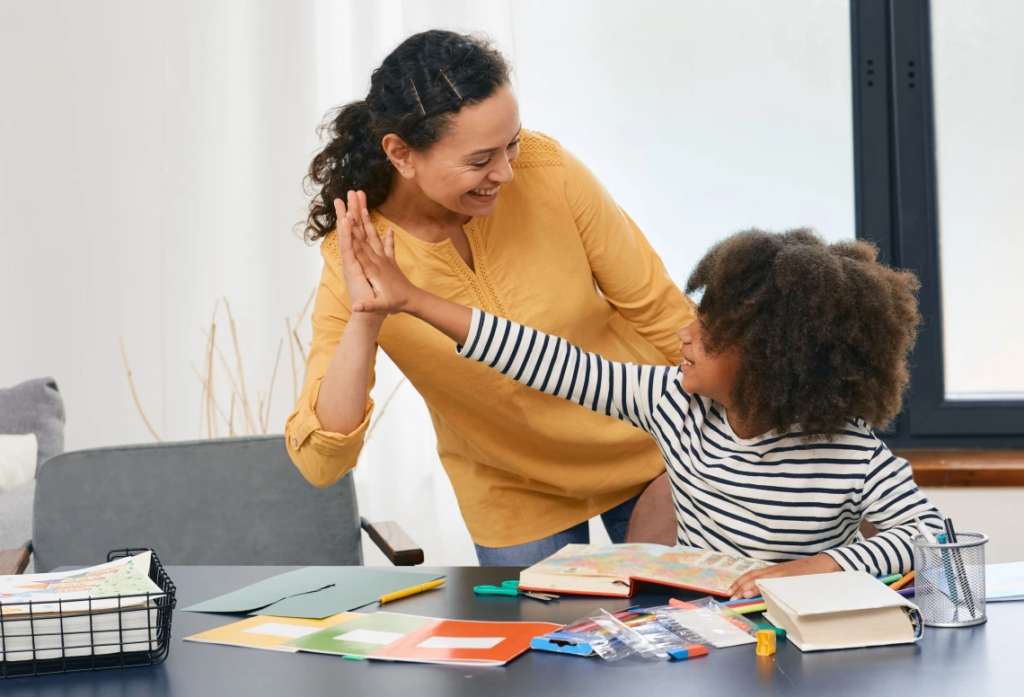 African American girl with autistic disorder with child's psychologist while psychological treatments for kid