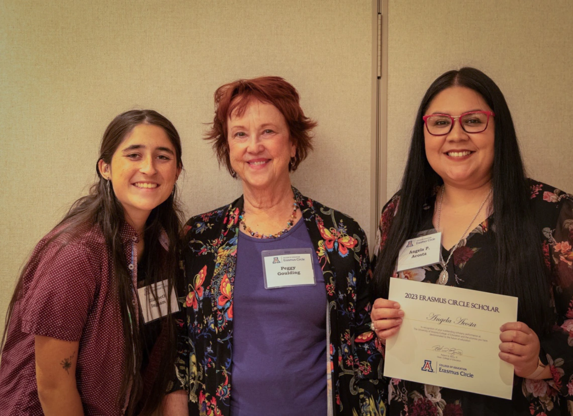 peggy goulding standing with two other women accepting her award