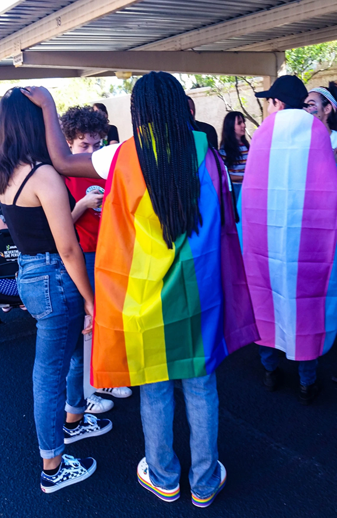 diverse group of young adults gathered in a group