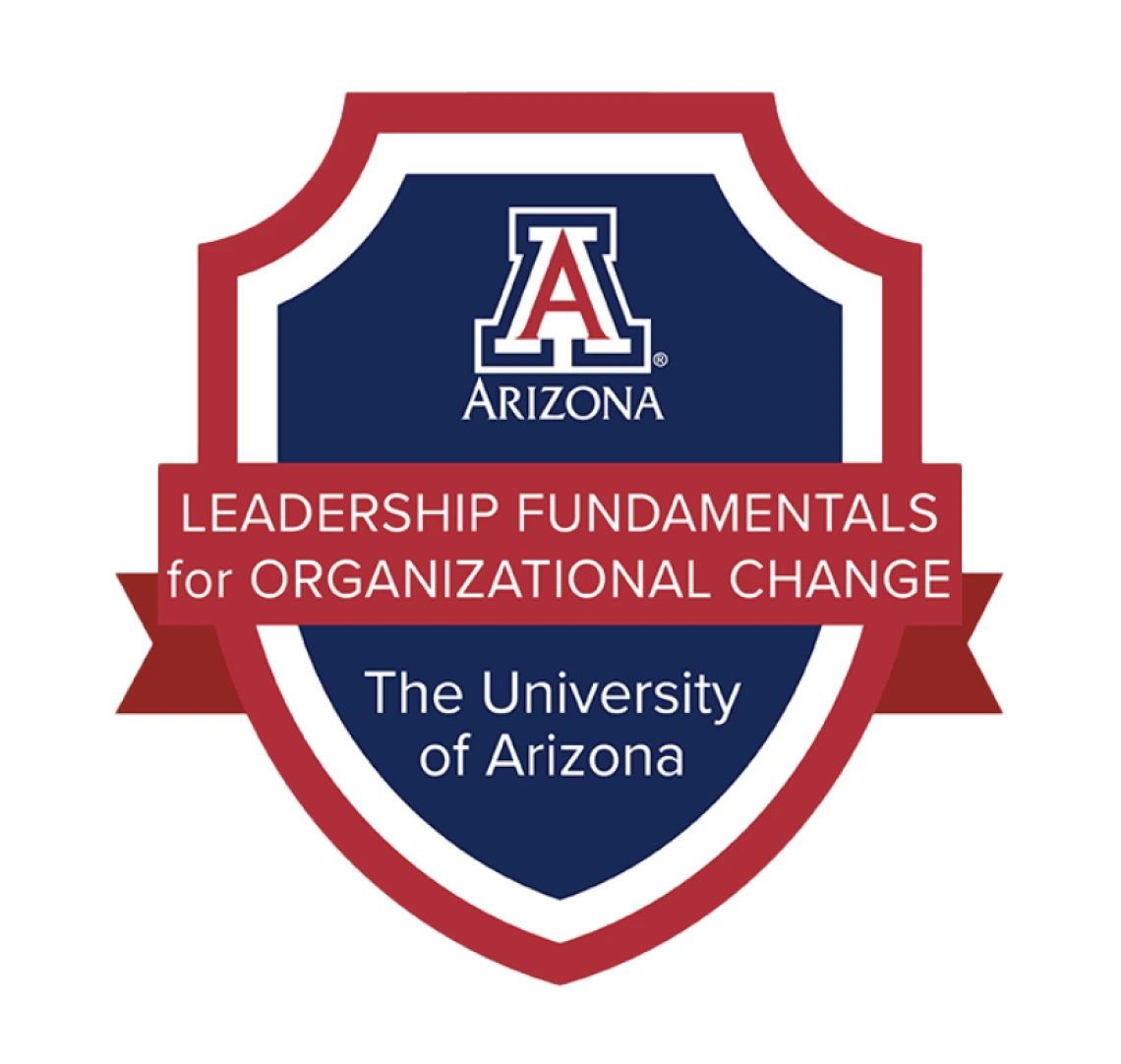 University of Arizona Leadership Fundamentals for Organizational Change badge featuring a red and blue shield with the university's 'A' logo at the top and text on a red ribbon banner.