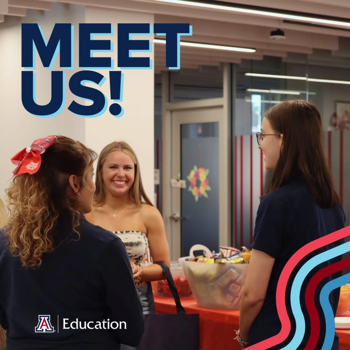 three students talking to each other, smiling and being social