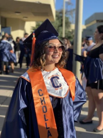 cholla high school graduate in cap in gown